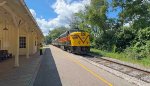 CVSR 6771 leaves the station agent and the empty station behind.